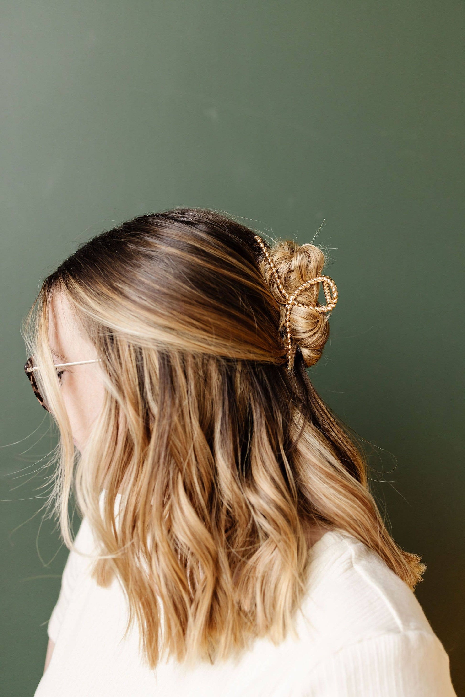 Twisted Gold Claw Clip in models hair