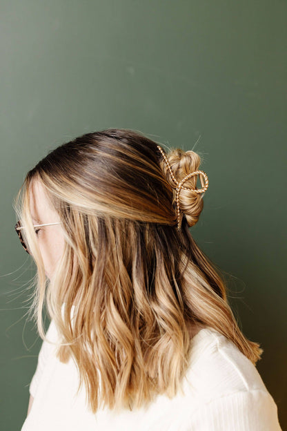 Twisted Gold Claw Clip in models hair